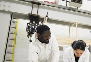 Two students in an engineering lab