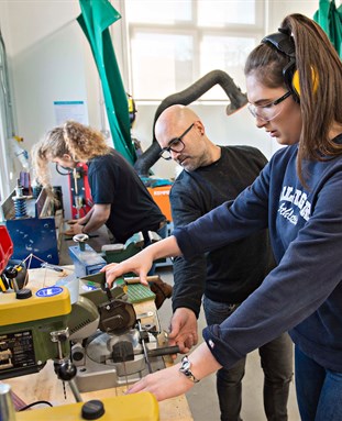 Student and technician using facilities in the workshop