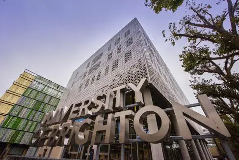 University of Brighton sign outside Elm House in Moulsecoomb