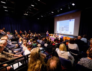 Audience and panel of experts at a University of Brighton Sallis Benney Theatre event