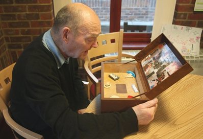 Man looking at a Music Memory Box