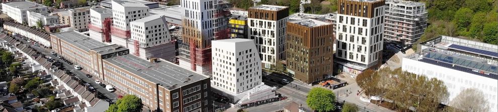 Aerial view of the Moulsecoomb campus showing the large scale developments of white and brown multi-storey blocks undertaken between 2018-2022 to provide specialist space for study and research