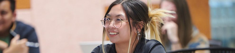 Student smiling in a lecture