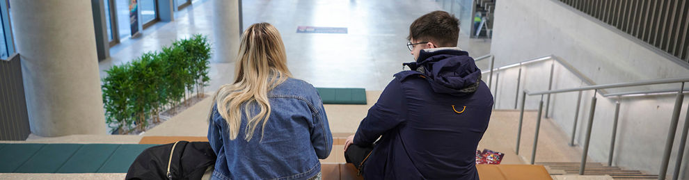 Students sat on steps in Elm House