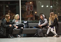 Four students on a sofa