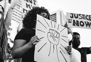 Demonstrators holding placards