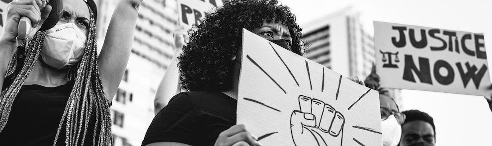 People holding placards at a demonstration