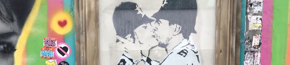Two policemen kissing - artwork by Banksy