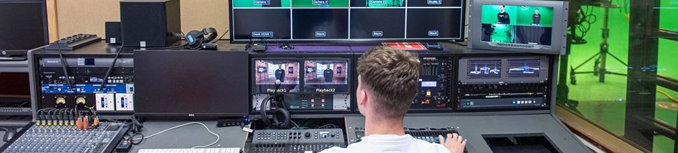 Student at banks of monitors