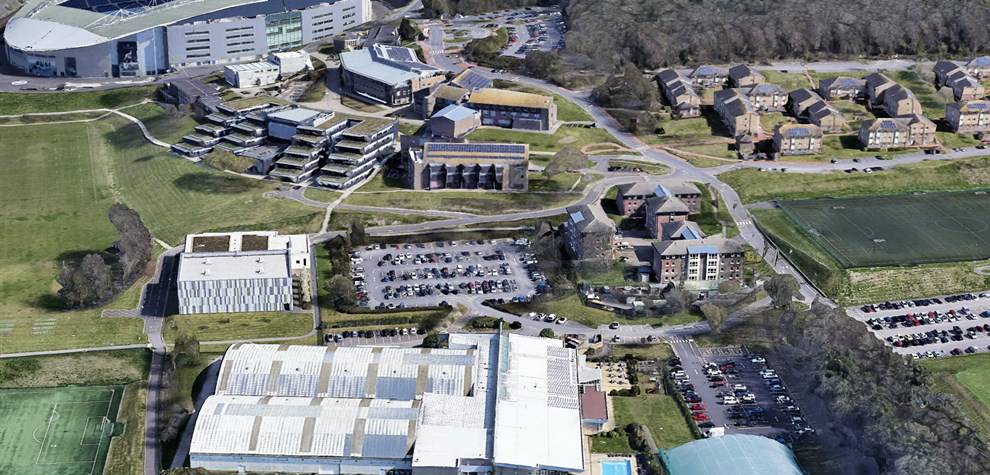 Aerial photo of Falmer campus showing academic buildings, sport facilities and halls of residence