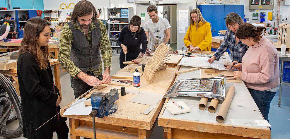 Students and staff working in the workshop