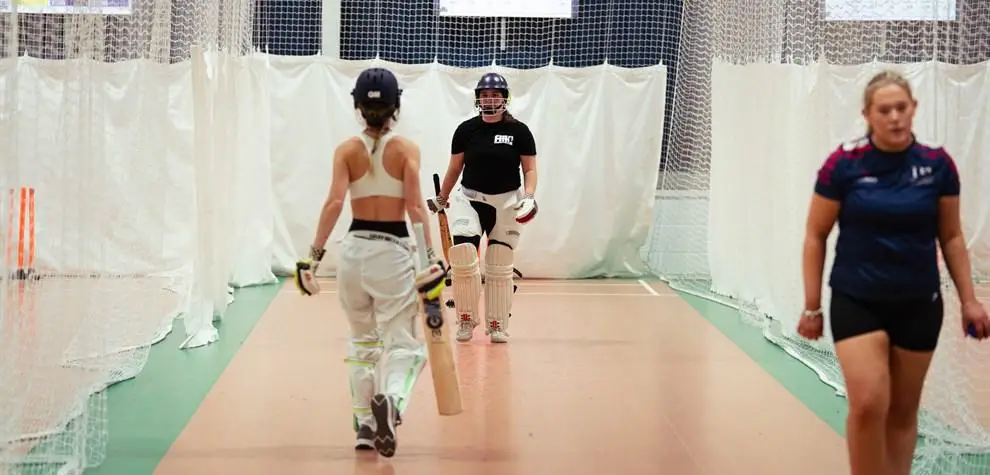 female players swap ends in nets
