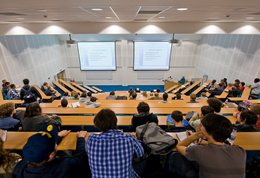 A crowd watching a lecture