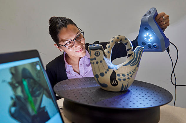 Digital scanner being used on pottery artefact