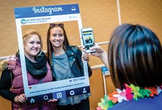 Two international students posing for a photograph