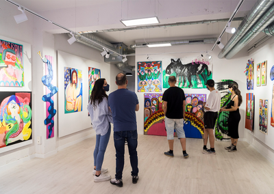 People looking at art in a room