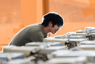Student with a bank of computers