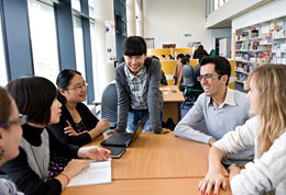International students meeting in the library