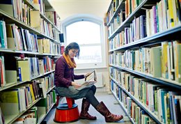 Student researching in the library