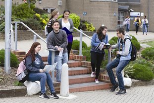 Group of study abroad students outside a university building