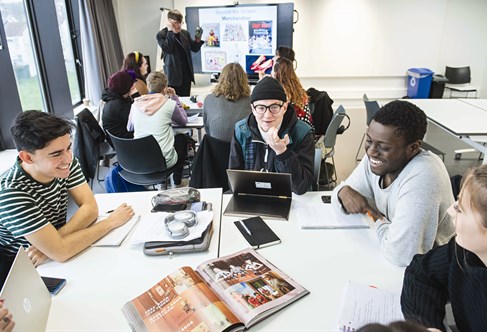 group of students talking in a seminar