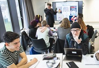 group of students talking in a seminar
