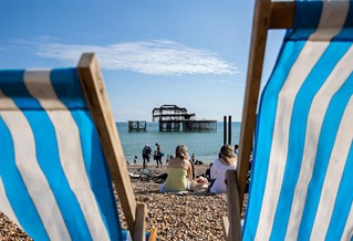 West Pier and deck chairs on the beach