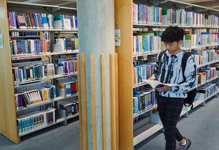 Brighton university student in Cockcroft library