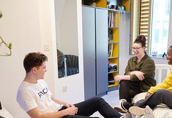 Three students in a student room