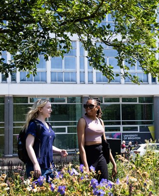 Two students outside City Campus Grand Parade
