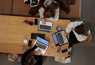 Students studying together inside Elm House