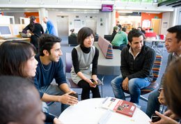 Students chatting round a table