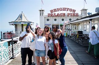 A group of students at Brighton Pier