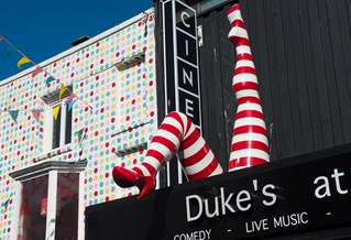 Red and white striped legs in the air