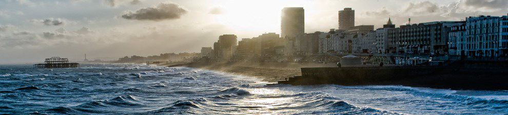 Sun setting over Brighton with tide coming in