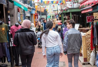 Students walking through shopping lane