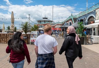 Students walking on the seafront