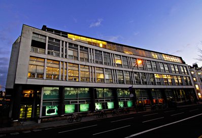 The outside of the Grand Parade Building at night