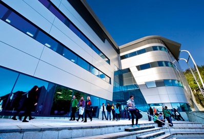 People milling outside the Huxley Building in Moulsecoomb