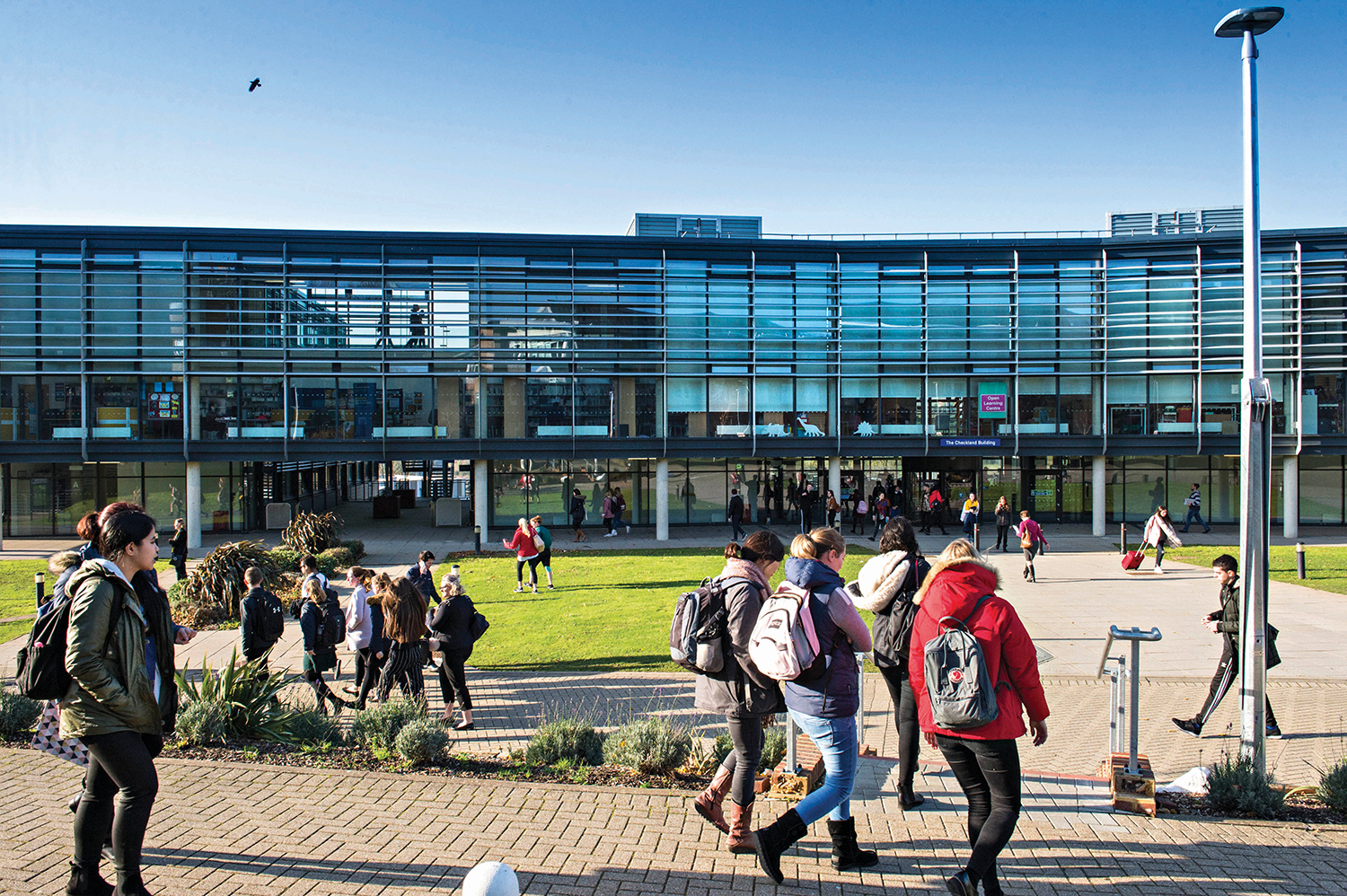 Students outside the Checkland Building