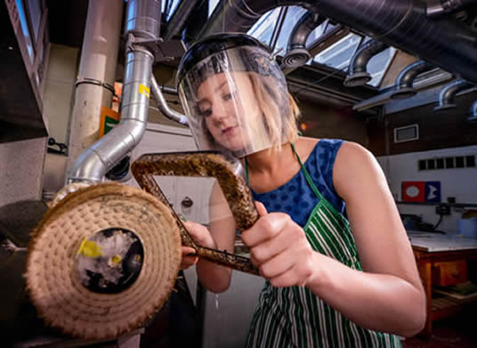 Amanda polishing a finished frame