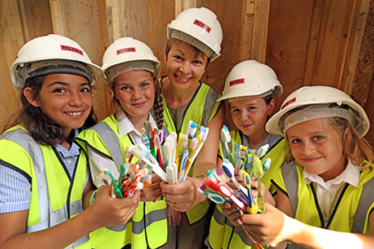 Pupils from St Andrew’s CE Primary School and MP Caroline Lucas with old toothbrushes.