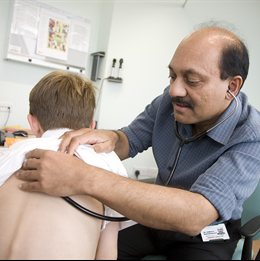 Professor Somnath Mukhopadhyay with a patient