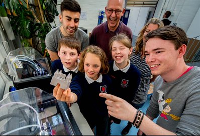 School children looking at a 3D printed castle