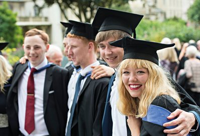 Graduates in gown in the Pavilion Gardens