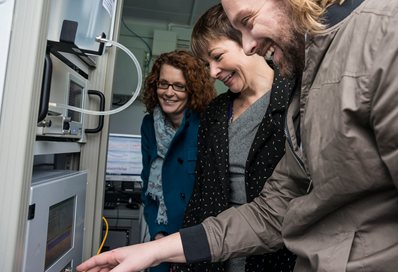 Dr Kirsty Smallbone, MP Caroline Lucas and Dr Kevin Wyche inside the air quality monitoring station