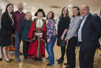 A line of people involved, including the mayor in her official robes