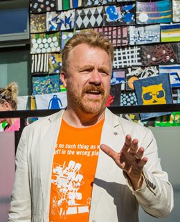 Duncan Baker-Brown talking in front of the Waste House
