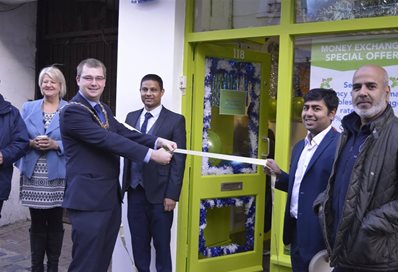 Mayor of Worthing, Alex Harman, opened the shop. Mohammad is in the centre.