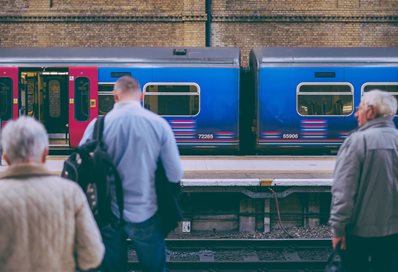 Commuters at train station photo by Callum Chapman on Unsplash